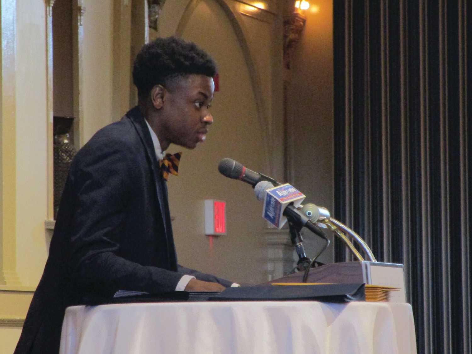 HONORED GUEST: Scholarship recipient John Quainoo shares a portion of his essay during the breakfast gathering at Rhodes on the Pawtuxet.